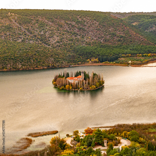 A Monastery on Visovac Island in Krka National Park, Croatia. Visovac, Christian monastery, Croatia. Little island on river Krka in National Park Krk. photo