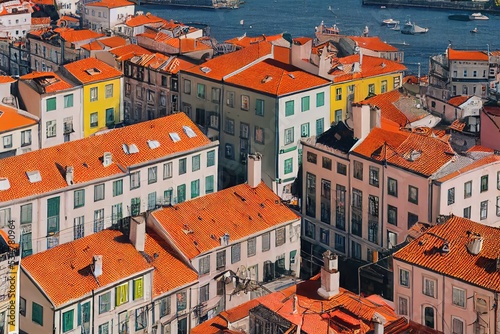 anime Typical cityscape of Lisbon Orange brick roof top of building and housing in old town with harbor view Narrow houses between small street in coastal of atlantic Lisbon is capital city of Portuga