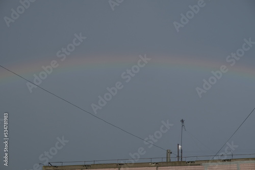 beautiful rainbow over the house in autumn summer spring winter