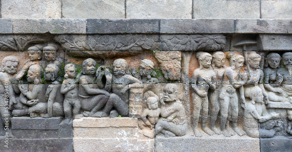Detail of Buddhist carved relief in Borobudur temple - Java, Indonesia Detail of Buddhist carved relief in Borobudur temple - Java, Indonesia