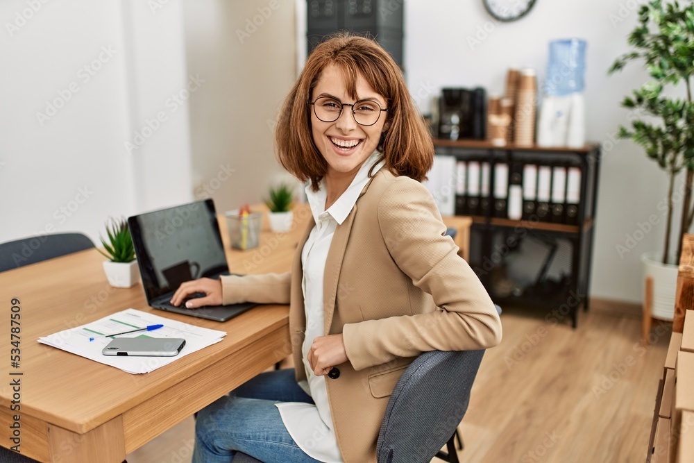 Young caucasian businesswoman smiling happy working at the office. Young caucasian businesswoman smiling happy working at the office.