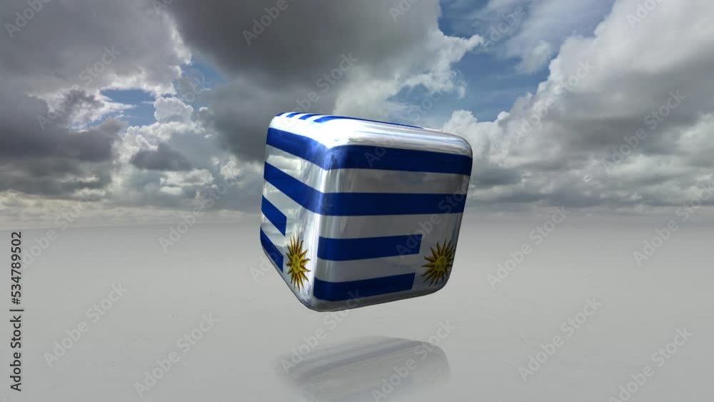 [Loop video] A loop animation in which a cube printed with a metallic Uruguay flag rotates.