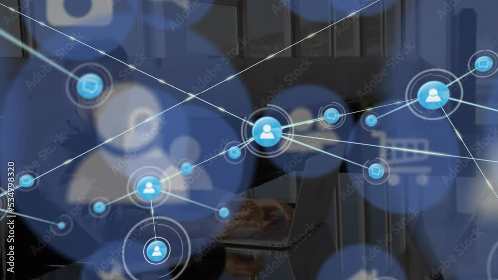 Animation of connections with icons over asian man working on laptop Animation of connections with icons over asian man working on laptop