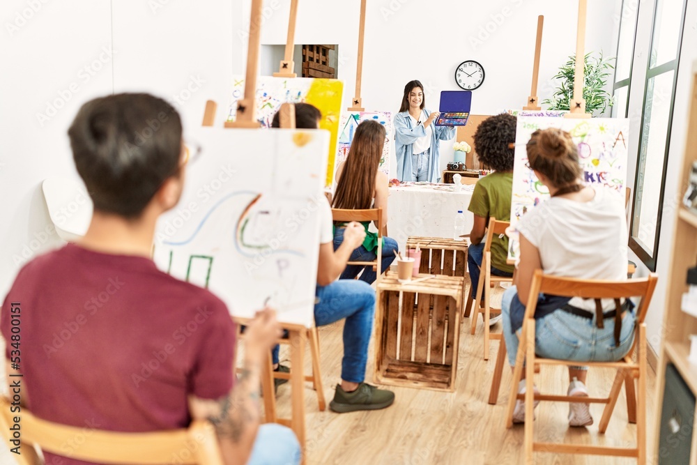 Group of paint students having draw lesson at art studio. Group of paint students having draw lesson at art studio.