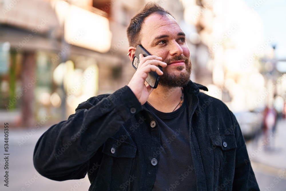 Young hispanic man smiling confident talking on the smartphone at street Young hispanic man smiling confident talking on the smartphone at street