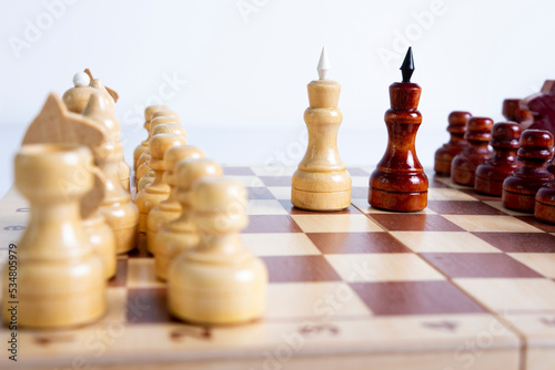 Obraz na płótnie Chess on a chessboard close-up two kings. Black and white chess pieces on the chessboard. Beginning of chess game. w salonie