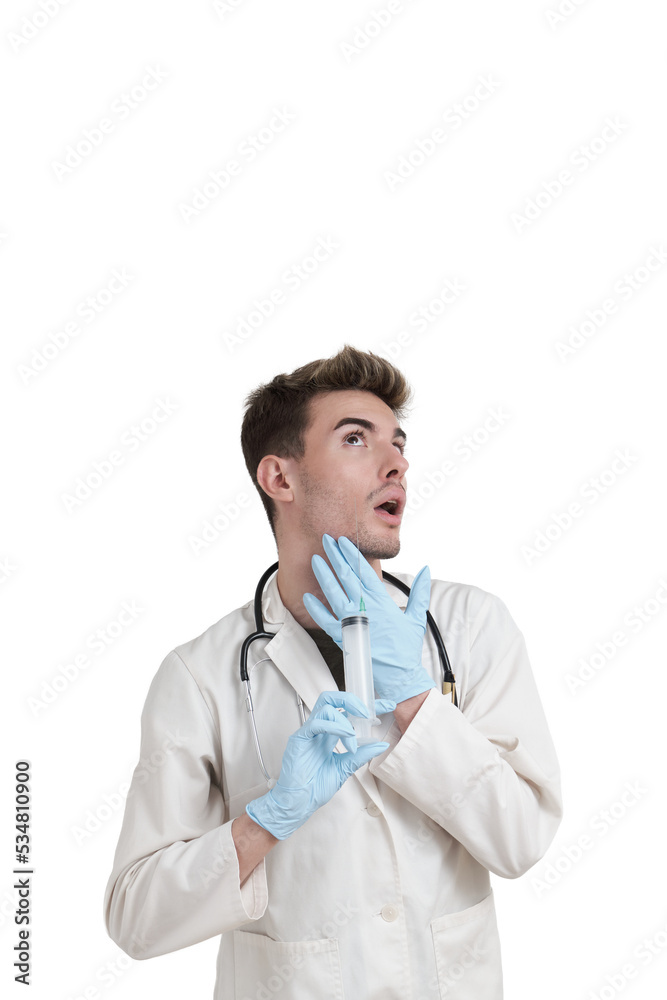 Young caucasian beautician giving face lifting injection to himself with a big syringe and needle. Isolated over white background. Young caucasian beautician giving face lifting injection to himself with a big syringe and needle. Isolated over white background.
