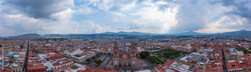 Aerial: epic view of the landscape and cityscape in Morelia, Mexico. Drone view
