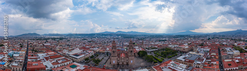 Aerial: epic view of the landscape and cityscape in Morelia, Mexico. Drone view 