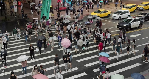Wallpaper Mural Pedestrian walk in the street in Taipei city in rain day Torontodigital.ca