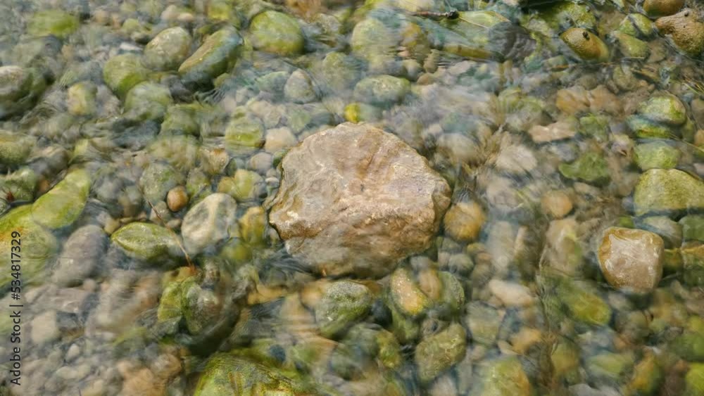 Big stone in the middle of a stream of clear water. Big stone in the middle of a stream of clear water.