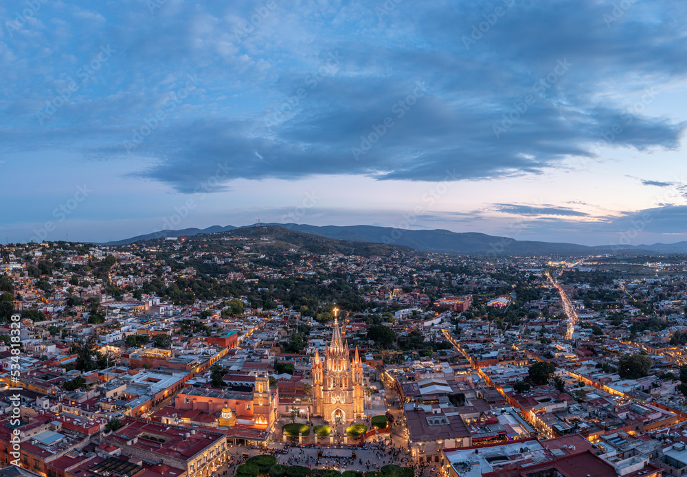 Aerial: San Miguel de Allende scenic downtown and landscape in the evening. Drone view
