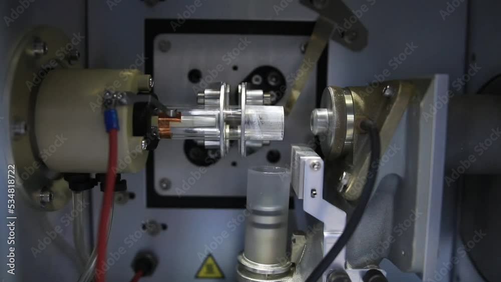 Details from an ICP-OES equipement where a radio frequency is used to heat a argon plasma and create atomic emission for chemical analysis purposes Details from an ICP-OES equipement where a radio frequency is used to heat a argon plasma and create atomic emission for chemical analysis purposes
