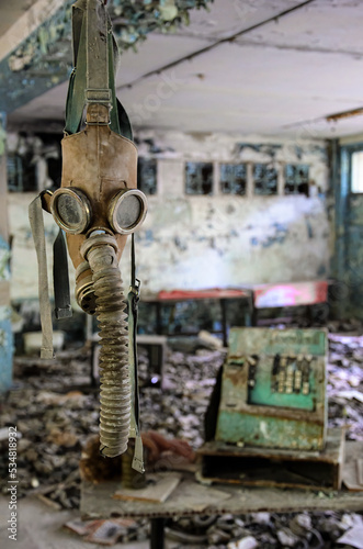 Fototapeta Naklejka Na Ścianę i Meble -  Hanging gas mask in a classroom in Prypiat. Chernobyl Exclusion Zone, Ukraine