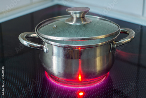 Heating a pot on electric stove - using electricity