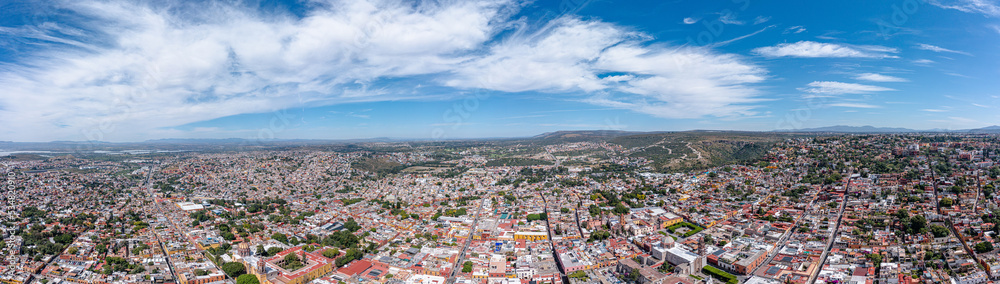 Aerial: panoramic cityscape and landscape in San Miguel de Allende. Drone view
