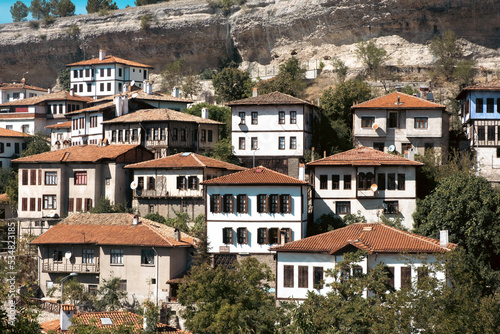 Safranbolu, Karabuk - October 2022: Front view of the historical Safranbolu houses. Unesco Safranbolu historical wooden mansions. Wooden houses on the mountainside.
