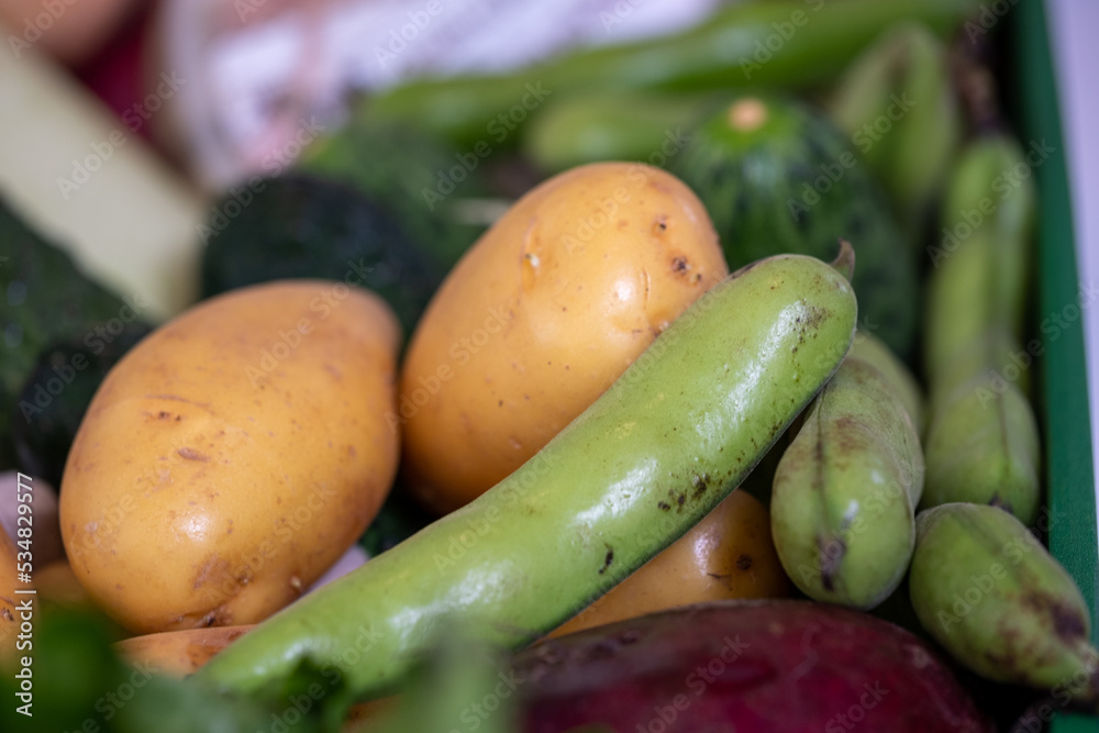 green box with vegetables, beets, potatoes, cucumbers in kitchen with white blurred background, kitchen poster, food advertisement green box with vegetables, beets, potatoes, cucumbers in kitchen with white blurred background, kitchen poster, food advertisement