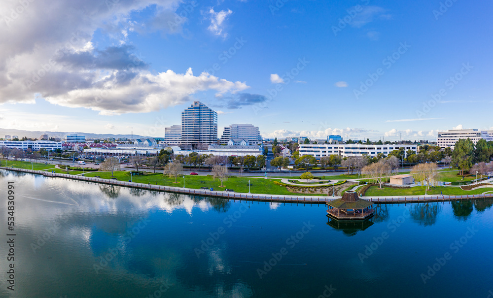 Aerial: panorama view of a lagoon and a city in California. Drone view
