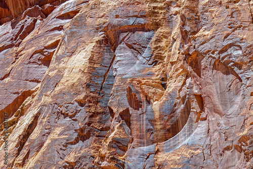 Erosion produces pattern in the rock wall near Cassidy Arch at Capitol Reef National Park, Utah, USA photo