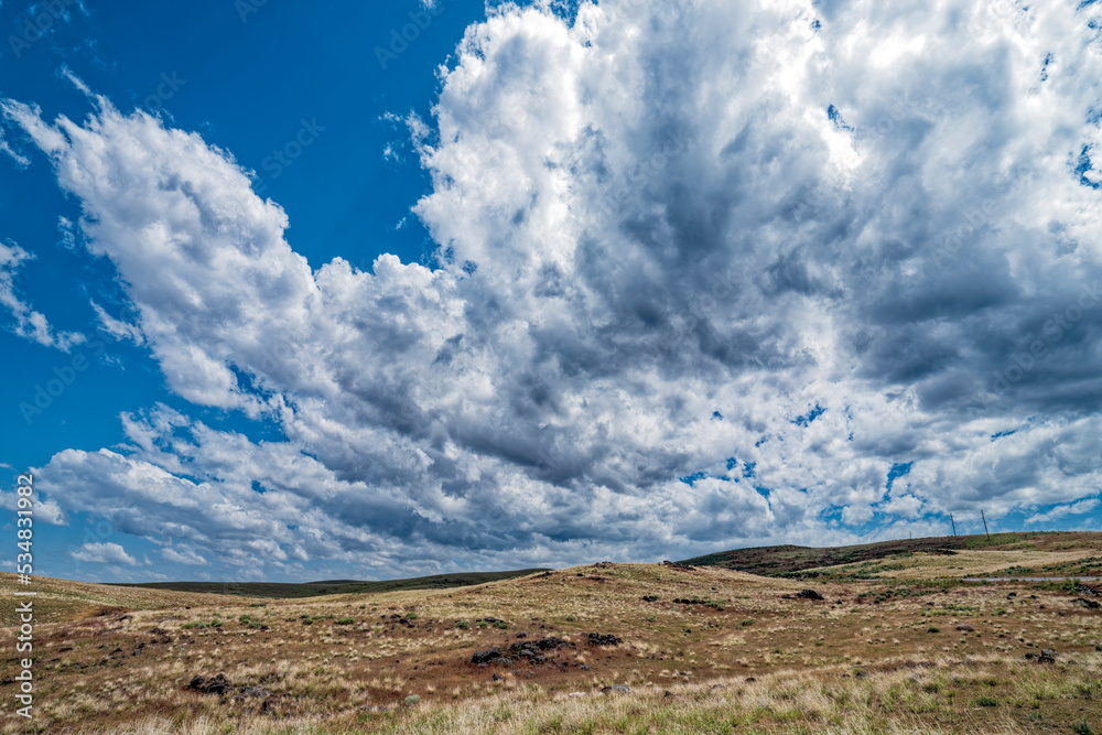 Clouds blowing over the prairie near Bruneau, Idaho, USA