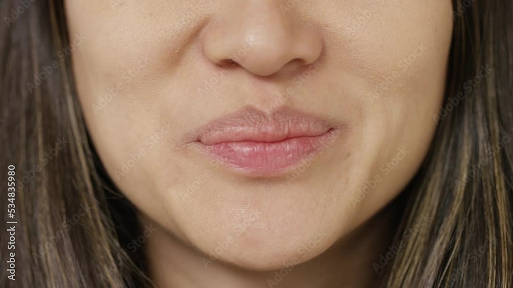 Close shot of female mouth talking directly to camera Close shot of female mouth talking directly to camera