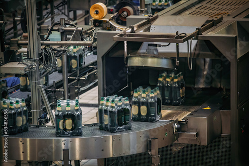 Modern automated beer bottling packing production line © Mulderphoto