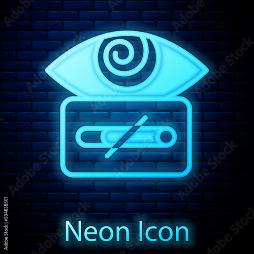 Glowing neon Hypnosis icon isolated on brick wall background. Human eye with spiral hypnotic iris. Vector