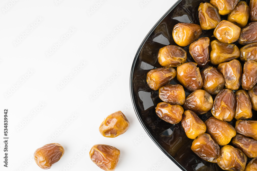 Delicious Sukari dates ( kurma sukari ) Much sought after during the month of Ramadan as a dish to break the fast, ramadhan kareem, in white background, empty space, copy space Delicious Sukari dates ( kurma sukari ) Much sought after during the month of Ramadan as a dish to break the fast, ramadhan kareem, in white background, empty space, copy space