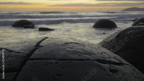 Close up of the Moeraki Boulders on the ocean shore, in New Zealand