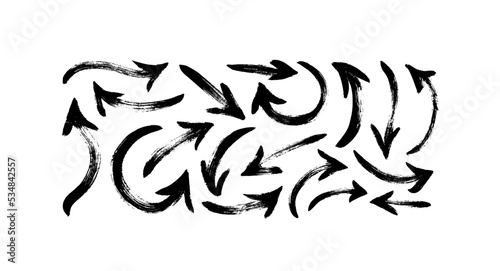 Hand drawn arrows vector icons set. Bold sketchy arrows isolated on white background. Curved and swirled brush strokes. Hand drawn grunge style elements. Simple black ink illustration.