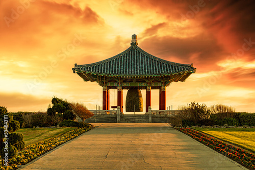 Beautiful traditional Korean design temple, gazebo, structure in the park at sunset 