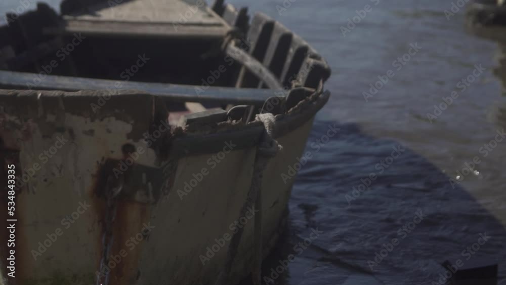 Detail of small boat moored on the beach. Ribeiro Beach, state of Espirito Santo - Brazil. Detail of small boat moored on the beach. Ribeiro Beach, state of Espirito Santo - Brazil.
