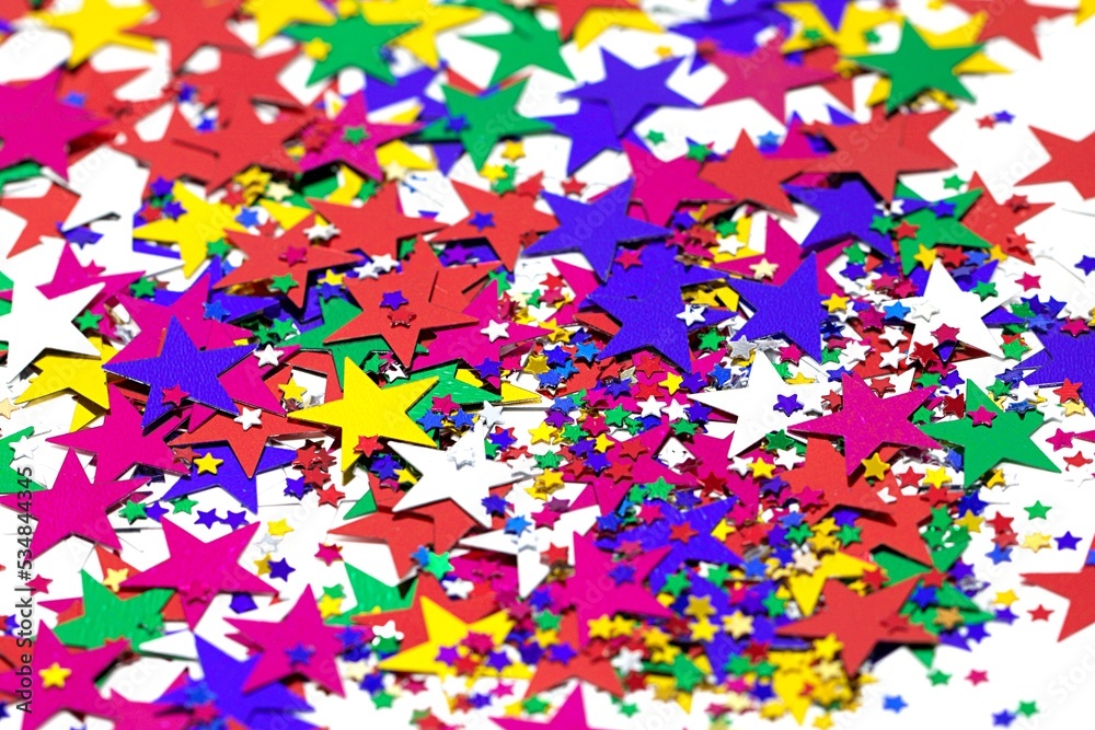 Fototapeta premium Konfetti Sterne bunt auf weißen Hintergrund.