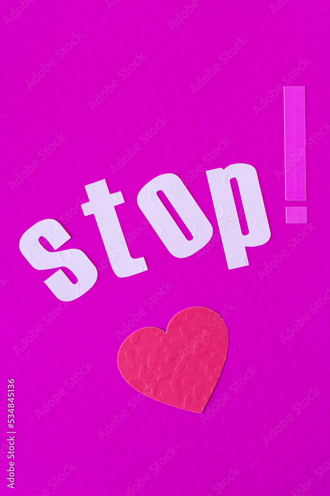 stop! and paper heart on pink