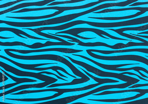 grungy blue paper background with zebra or tiger prints