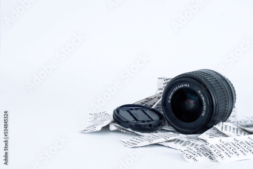 The camera lens is given silica gel to keep it dry on white background photo