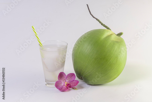 Coconut juice with fresh young coconut fruit isolated on white background.