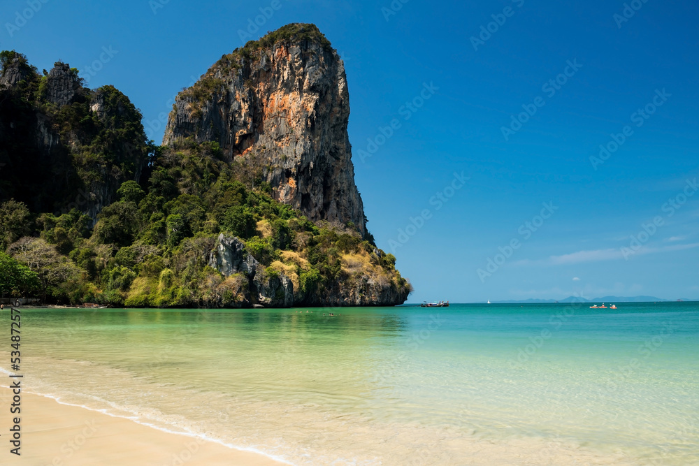 Railay west beach with limestone mountain and blue sky in Krabi