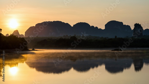 Nong Thale viewpoint at sunrise. Beautiful motion mist over swamp © Blanscape