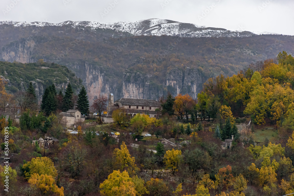 View of traditional architecture with    stone buildings  during  fall season in Monodendri village, zagori Greece
