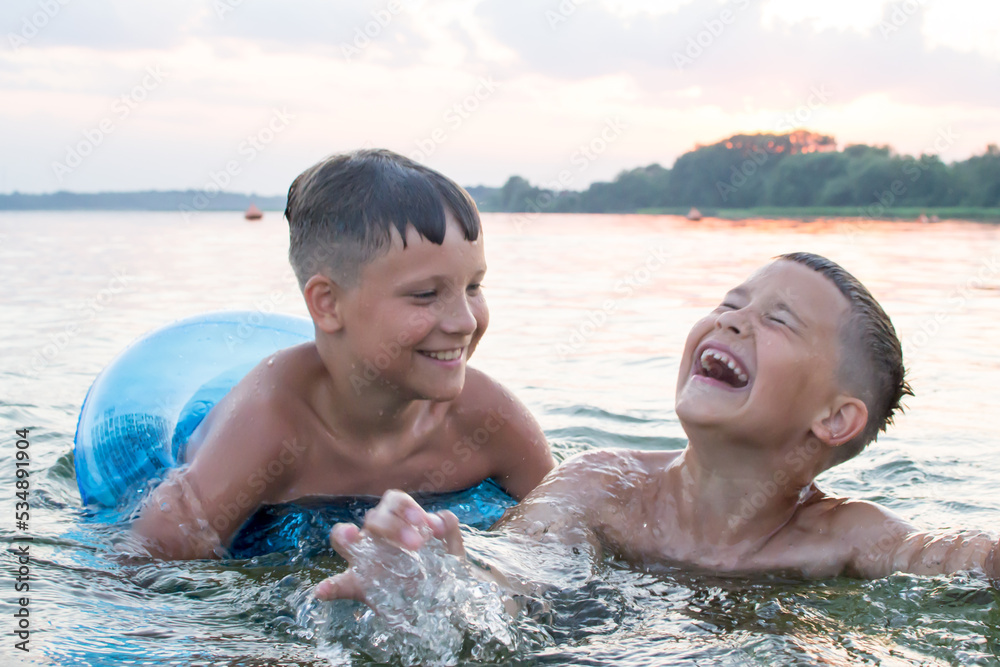 The brothers swim in the lake. Summer evening. Lake Myastro
The brothers swim in the lake. Summer evening. Lake Myastro