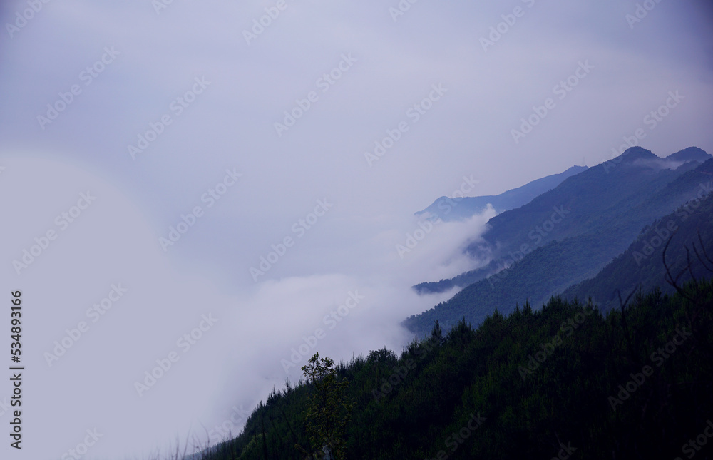 White clouds floating to the side of mountain range in Ta Xua, Vietnam