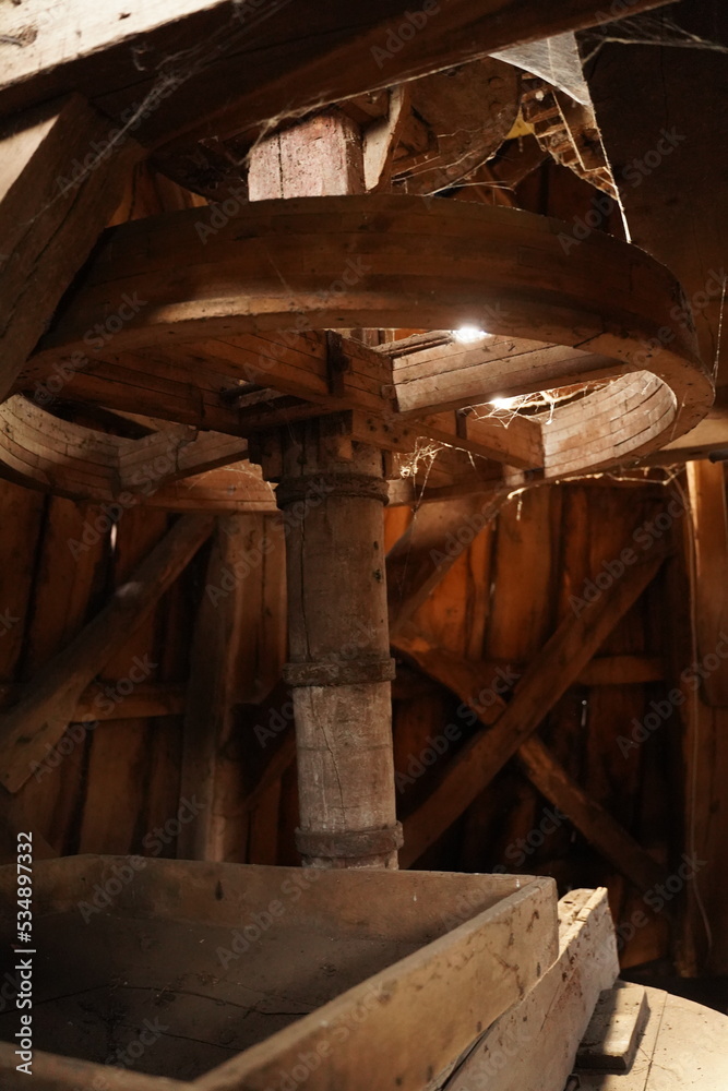 Huge wooden antique mill mechanism from the inside Huge wooden antique mill mechanism from the inside