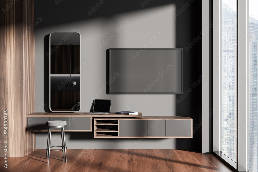 Grey chill room interior with tv and dresser with laptop, panoramic window Grey chill room interior with tv and dresser with laptop, panoramic window