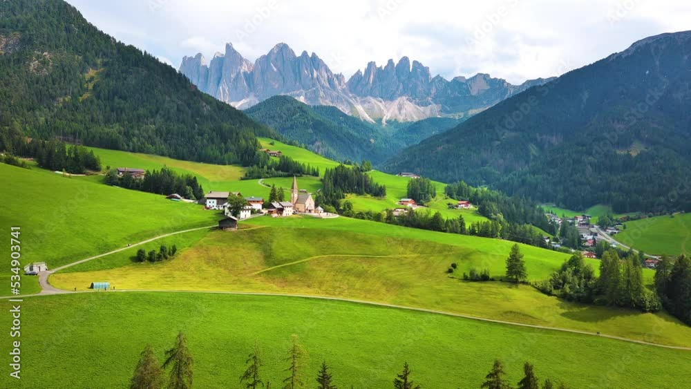 Flying over Santa Maddalena village (St Magdalena) in Dolomites mountains, Italy Flying over Santa Maddalena village (St Magdalena) in Dolomites mountains, Italy