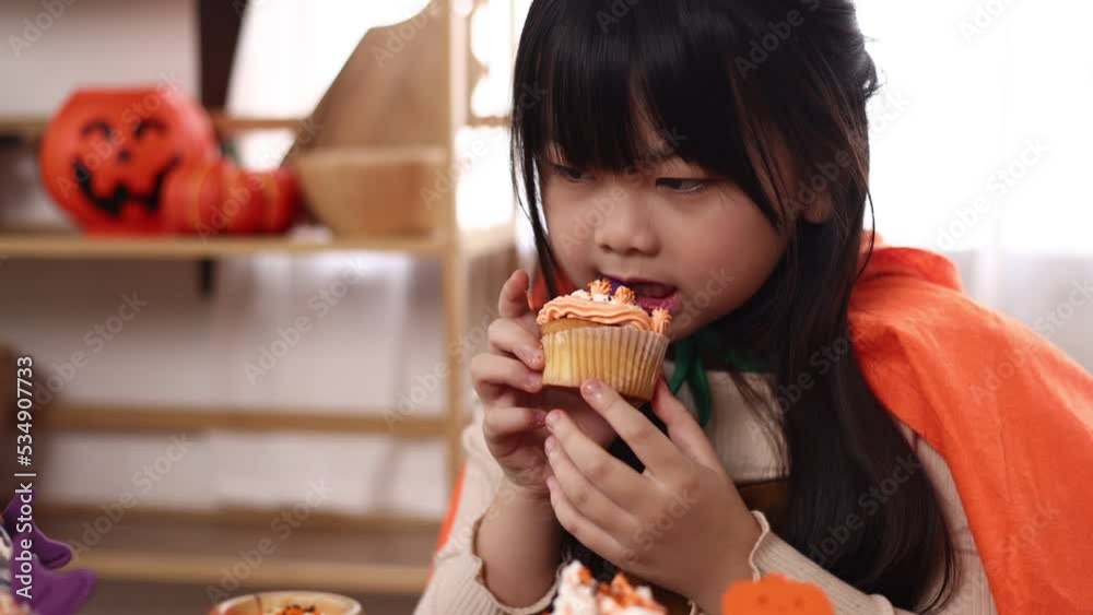 Happy halloween holiday, Children girl getting ready for holiday and baking cookies at home, Asian family, Happy halloween holiday, Children girl getting ready for holiday and baking cookies at home, Asian family,