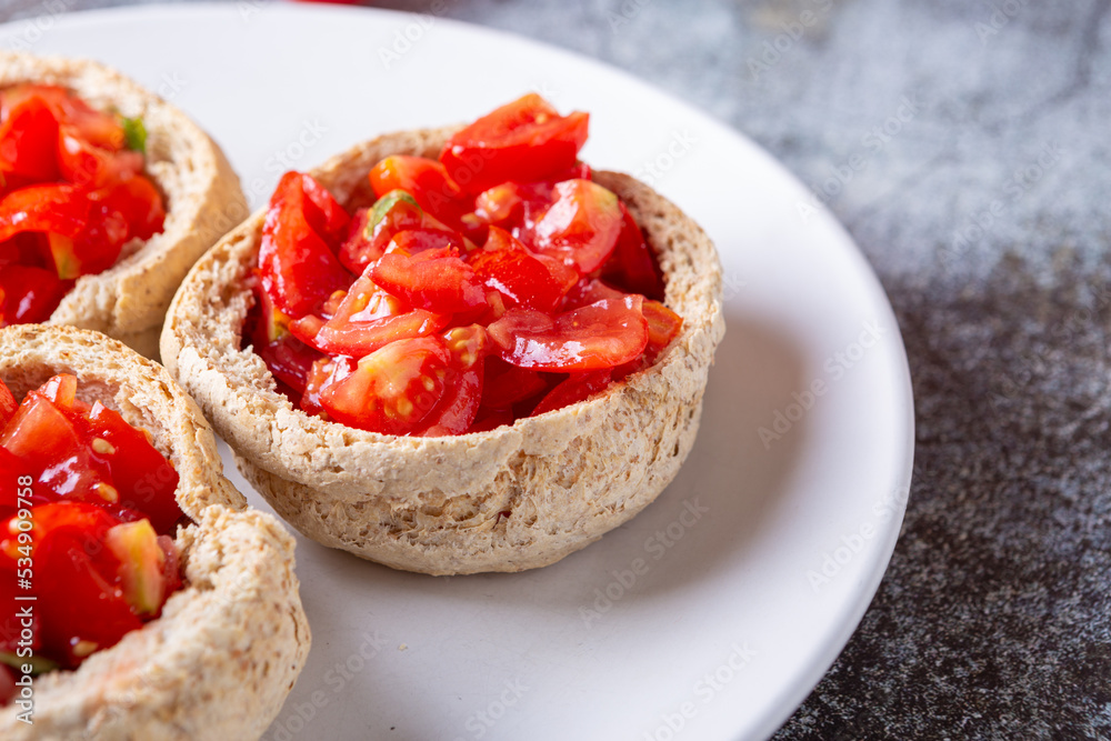 Bread baskets with cherry tomatoes. Quick, tasty and plant based appetizer.