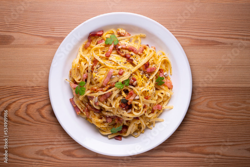 Spaghetti a la cardinale. Pasta cooked with cream and bacon. Traditional Italian recipe.