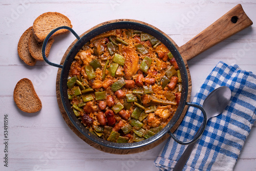 Paella with green beans and sausages. Typical Spanish paella tapa recipe with meat.